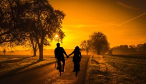 sunset, couple, bicycle-3754082.jpg